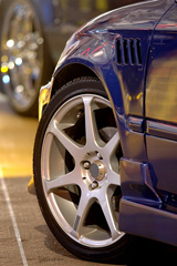 alloy car rim with blurred car rim in background